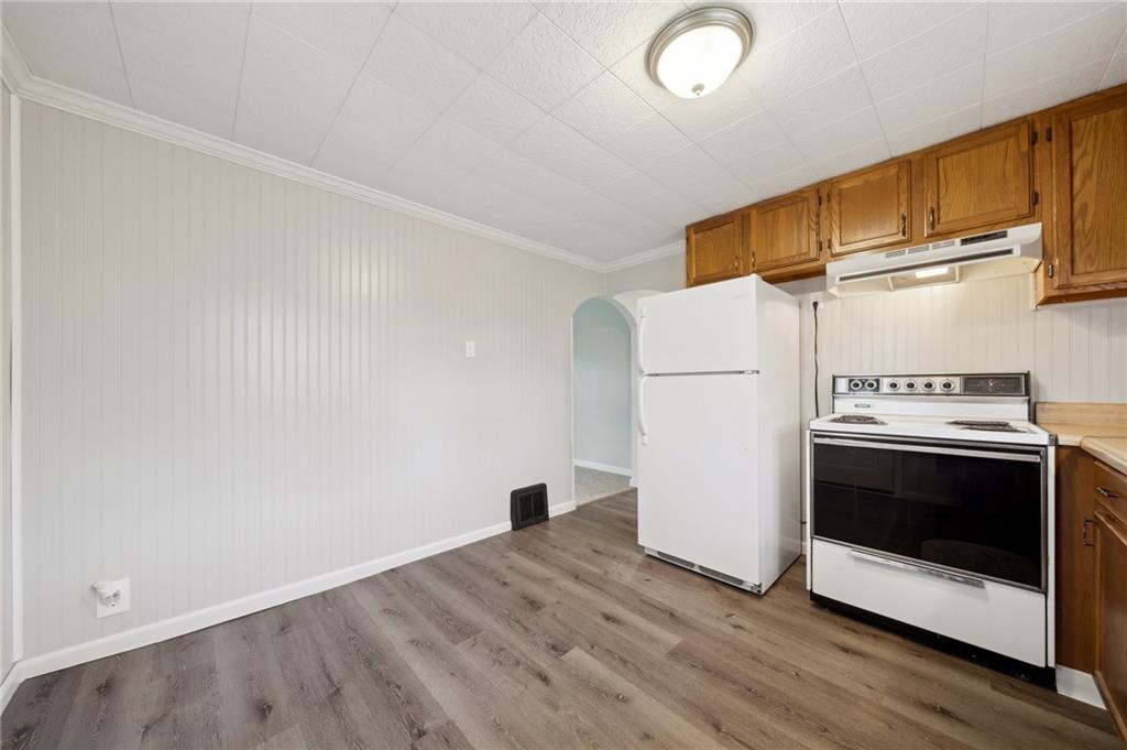 373 Club Sofia Road Uniontown, PA 15401 - Photo 8 of 28 a view of a kitchen with wooden floor and electronic appliances