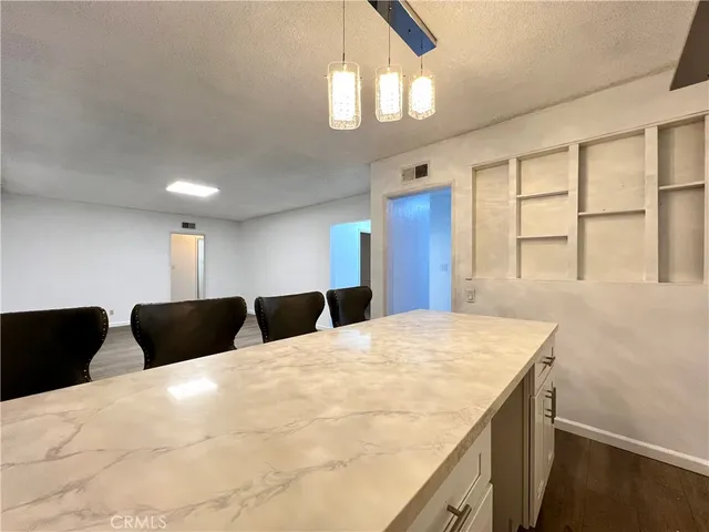 a kitchen with a stove and a refrigerator