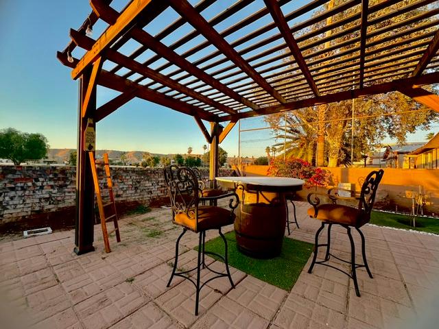 1395 Lause Road Bullhead City, AZ 86442 - Photo 26 of 34 Outdoor patio featuring a wooden pergola