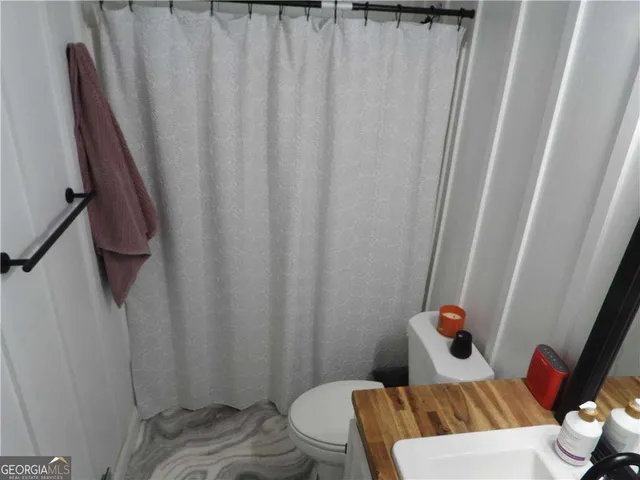 a bathroom with a sink and toilet