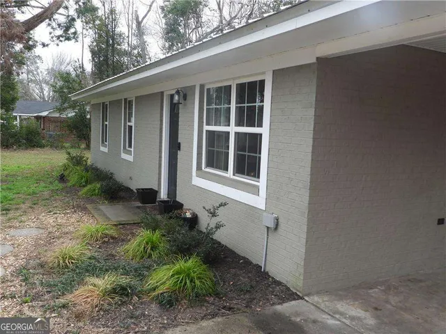 a house with trees in front of it