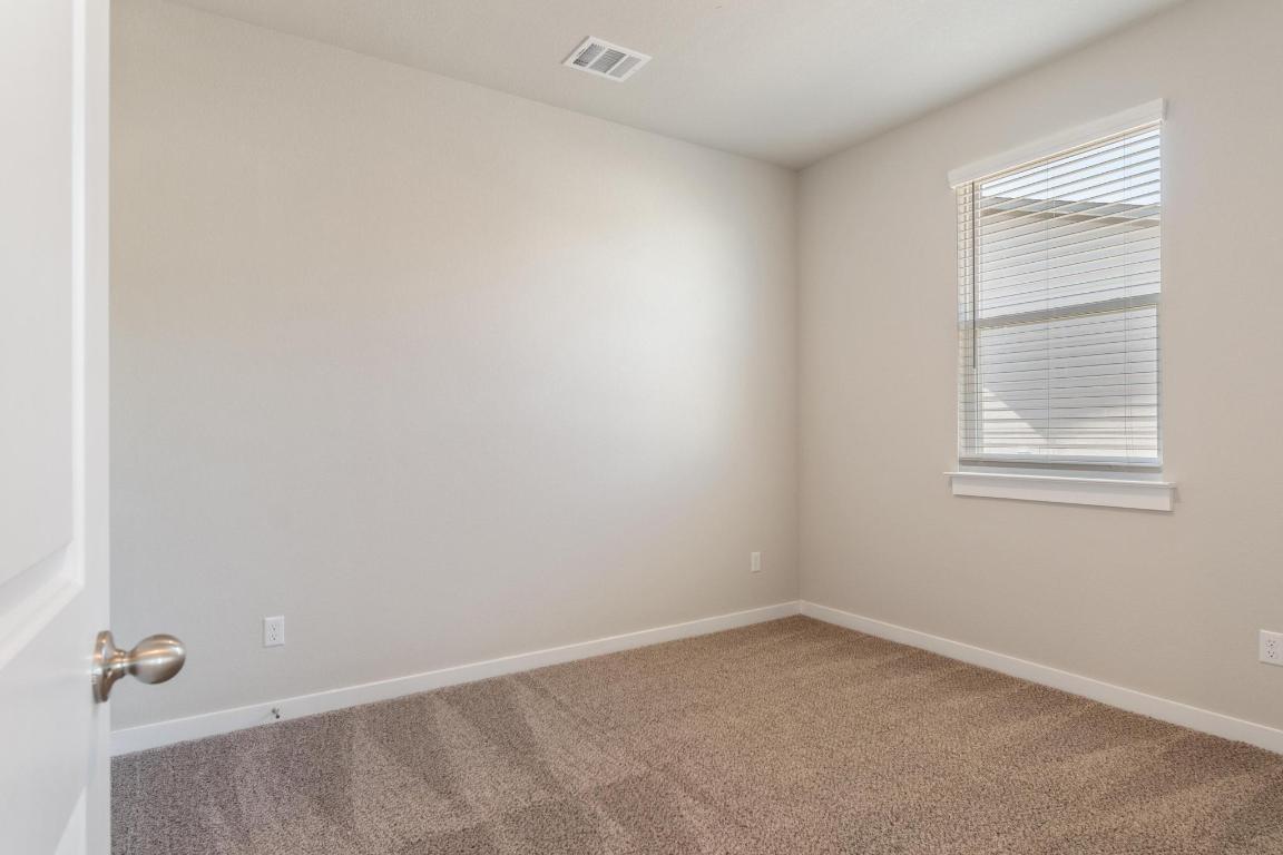 20105 Park Strip Street, Unit A B Lago Vista, TX 78645 - Photo 14 of 26 an empty room with a window