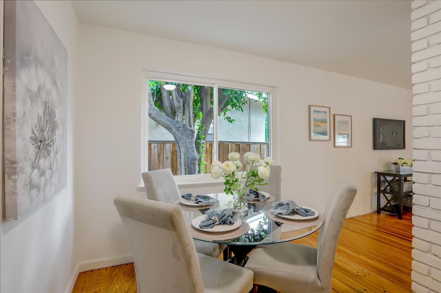 345 Silvera Street Milpitas, CA 95035 - Photo 17 of 38 a view of a dining room with furniture window and wooden floor