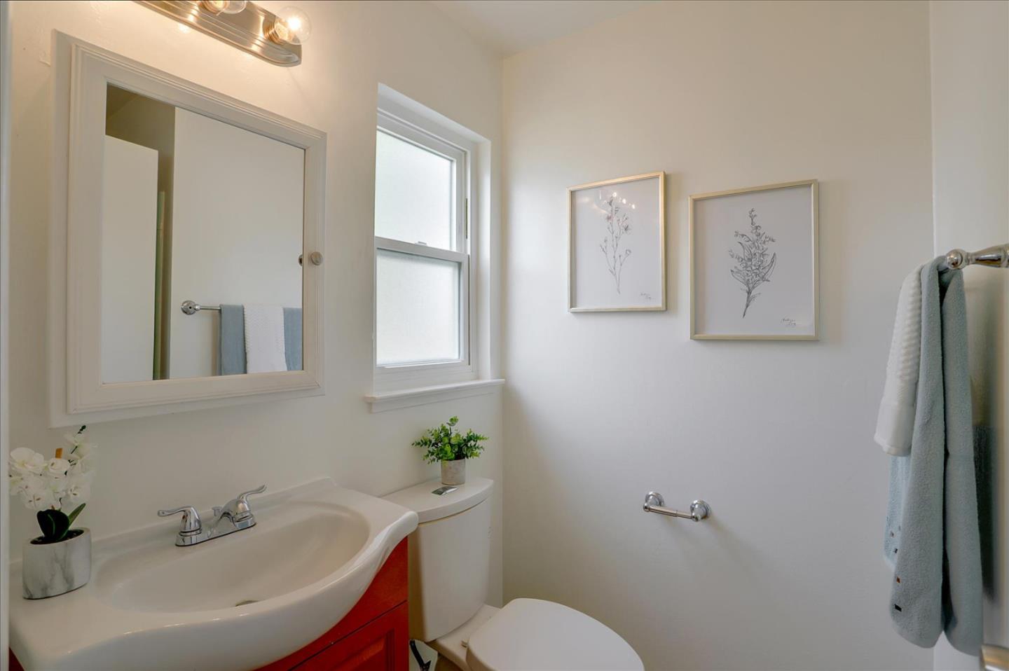 345 Silvera Street Milpitas, CA 95035 - Photo 30 of 38 a bathroom with a sink mirror and toilet