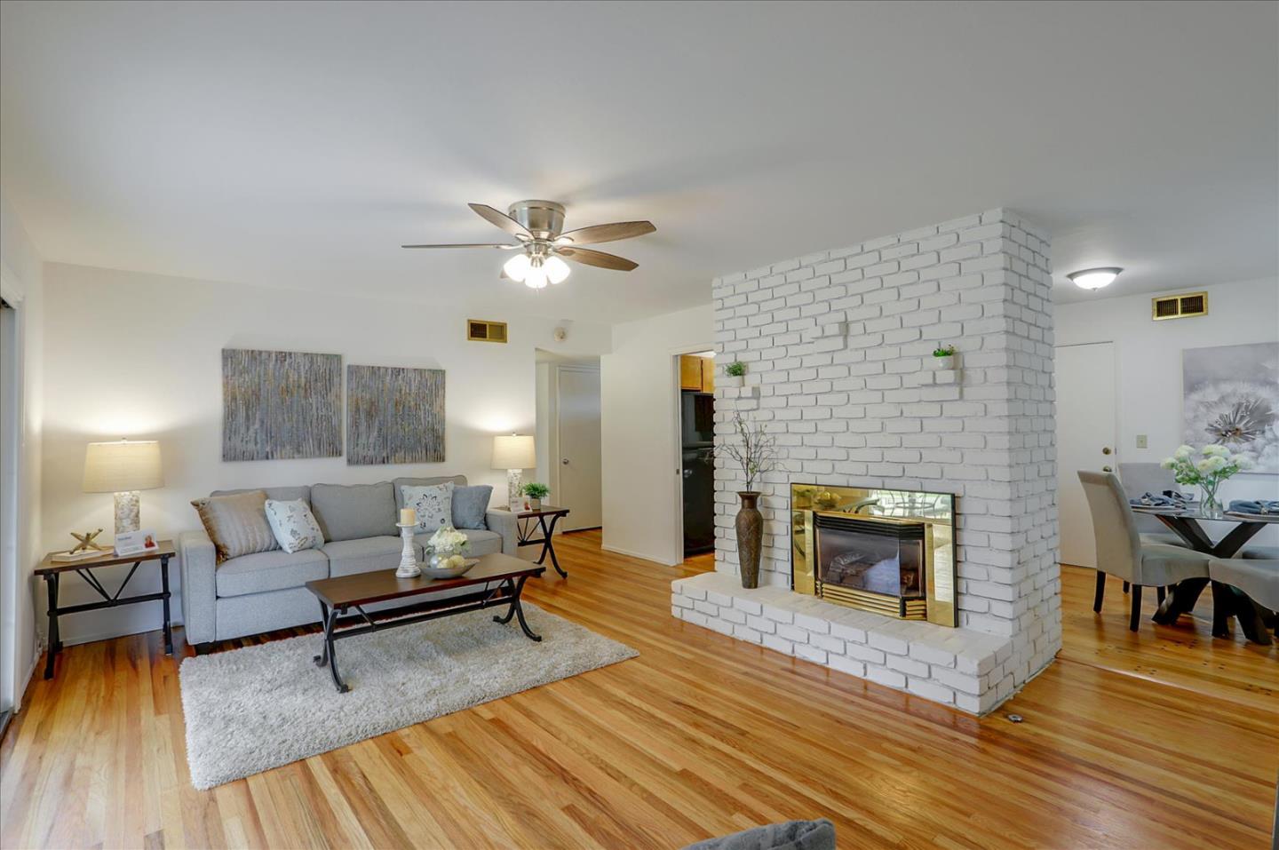 345 Silvera Street Milpitas, CA 95035 - Photo 8 of 38 a living room with furniture and a fireplace