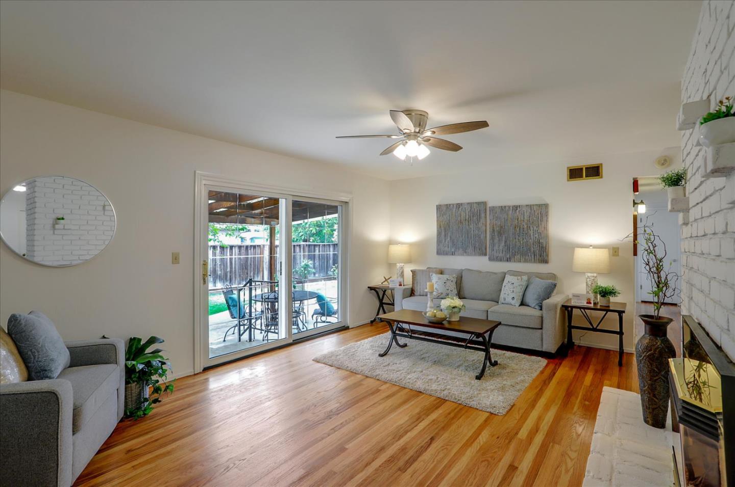 345 Silvera Street Milpitas, CA 95035 - Photo 9 of 38 a living room with furniture and a wooden floor