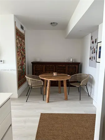 a kitchen with a sink stove and refrigerator