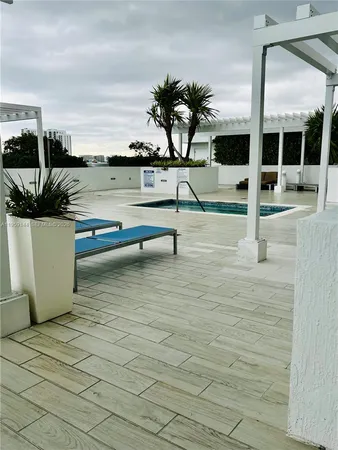 a view of balcony patio outdoor dining table and chairs