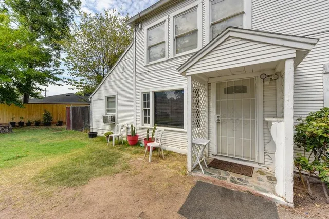 a view of a workspace with furniture and wooden floor