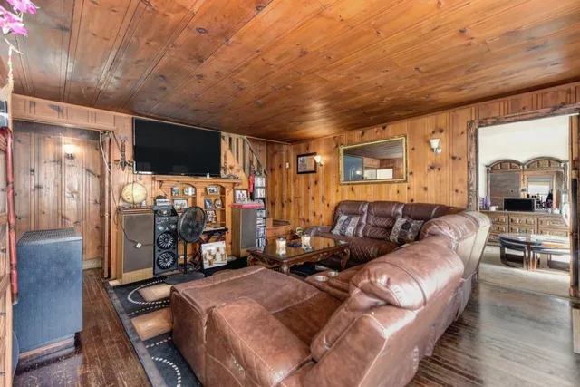 a kitchen with white cabinets and sink