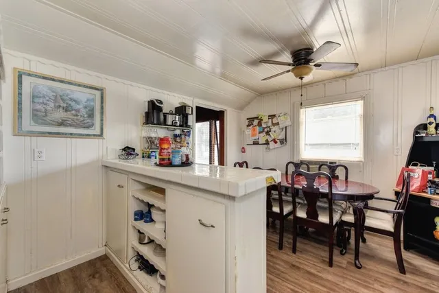 a bedroom with a bed and a chair