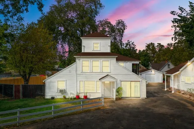 a front view of a house with a yard