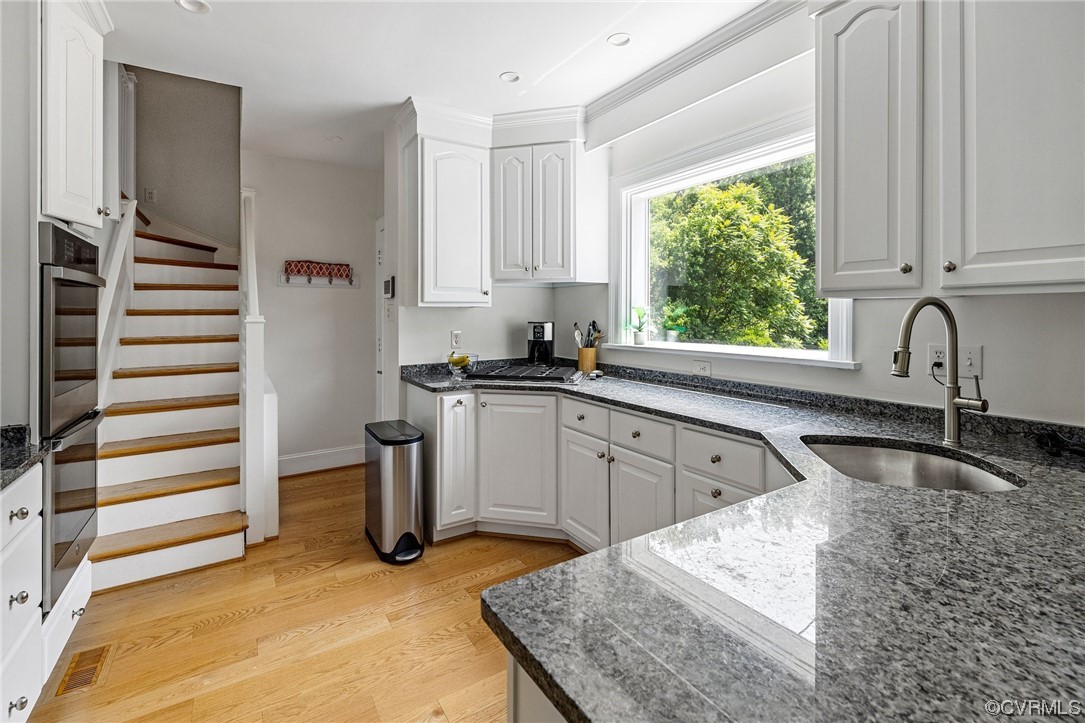 4105 Sulgrave Road Richmond, VA 23221 - Photo 5 of 30 a kitchen with stainless steel appliances granite countertop a sink stove and refrigerator