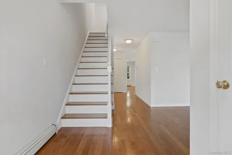 a view of balcony with wooden floor