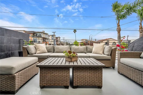 a view of a livingroom with furniture and outdoor kitchen
