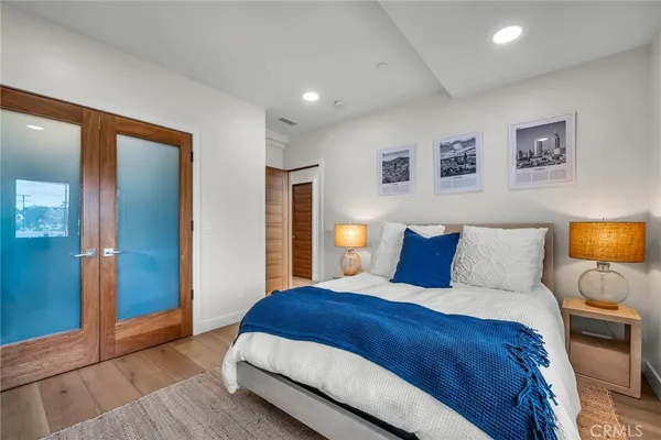 a bedroom with a large bed and a couch