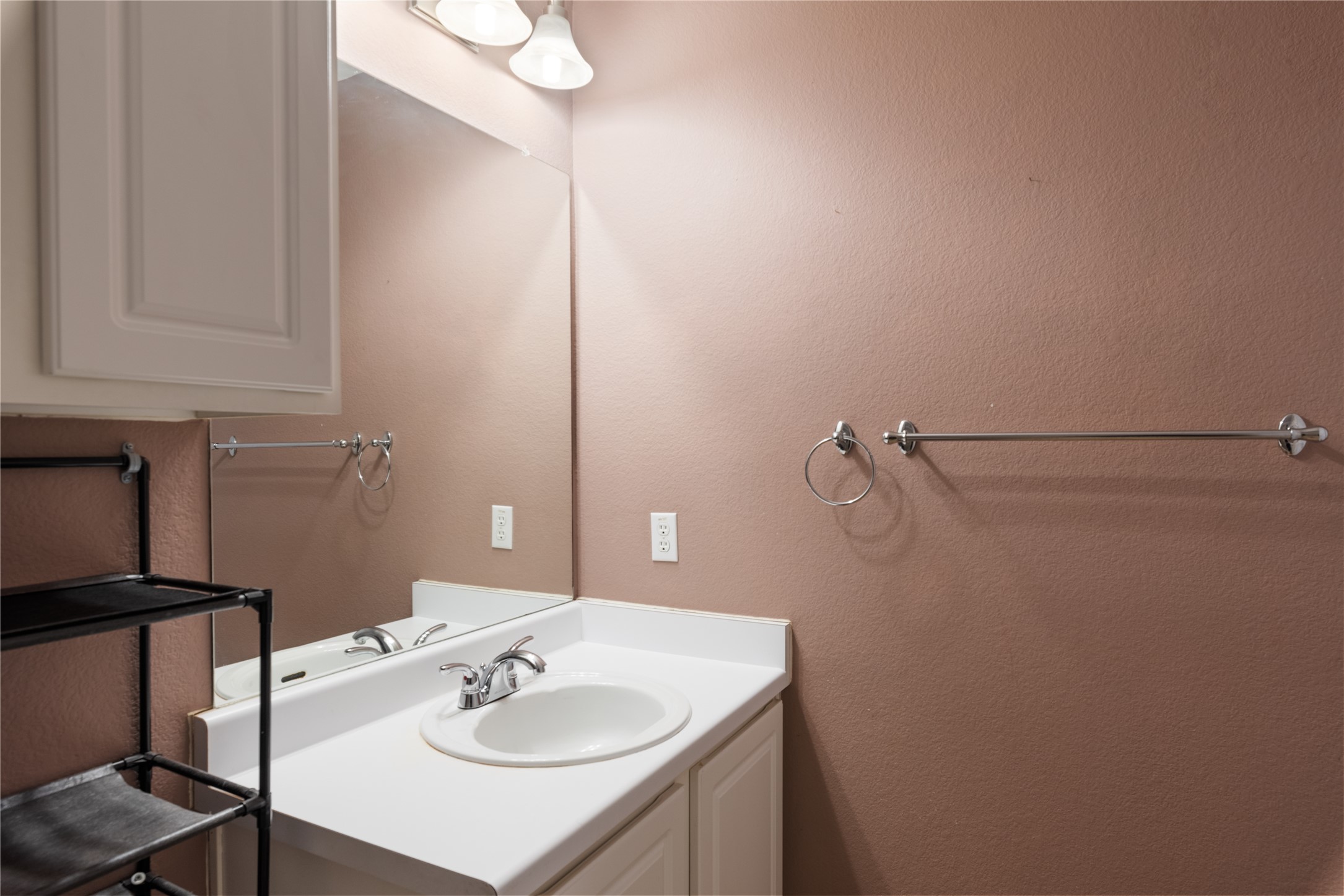 1329 Amberwood Loop Kyle, TX 78640 - Photo 21 of 27 a bathroom with a sink and a mirror