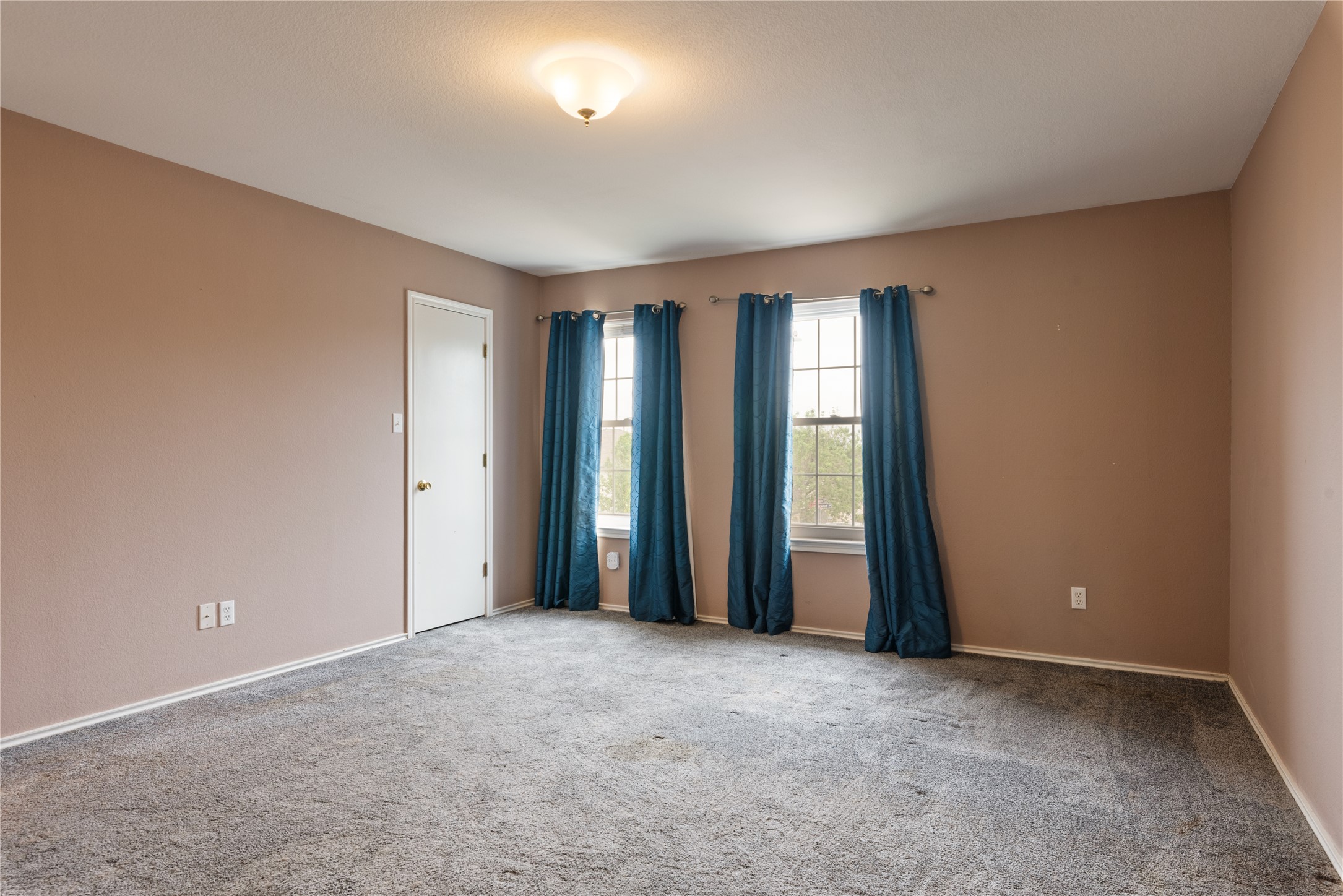 1329 Amberwood Loop Kyle, TX 78640 - Photo 22 of 27 an empty room with windows and closet