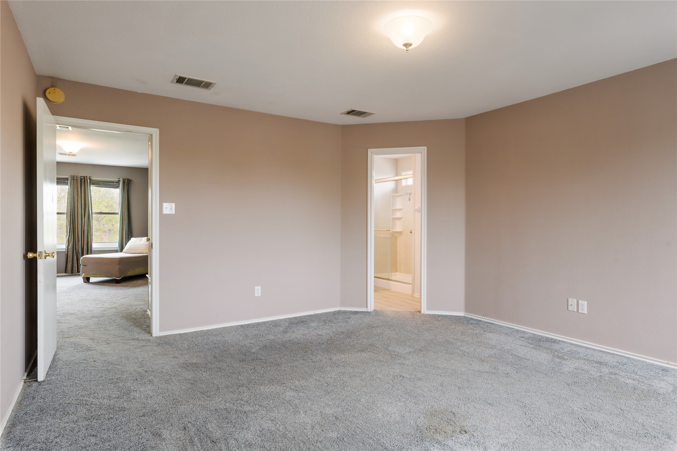 1329 Amberwood Loop Kyle, TX 78640 - Photo 23 of 27 a view of a room with a livingroom and a bathroom