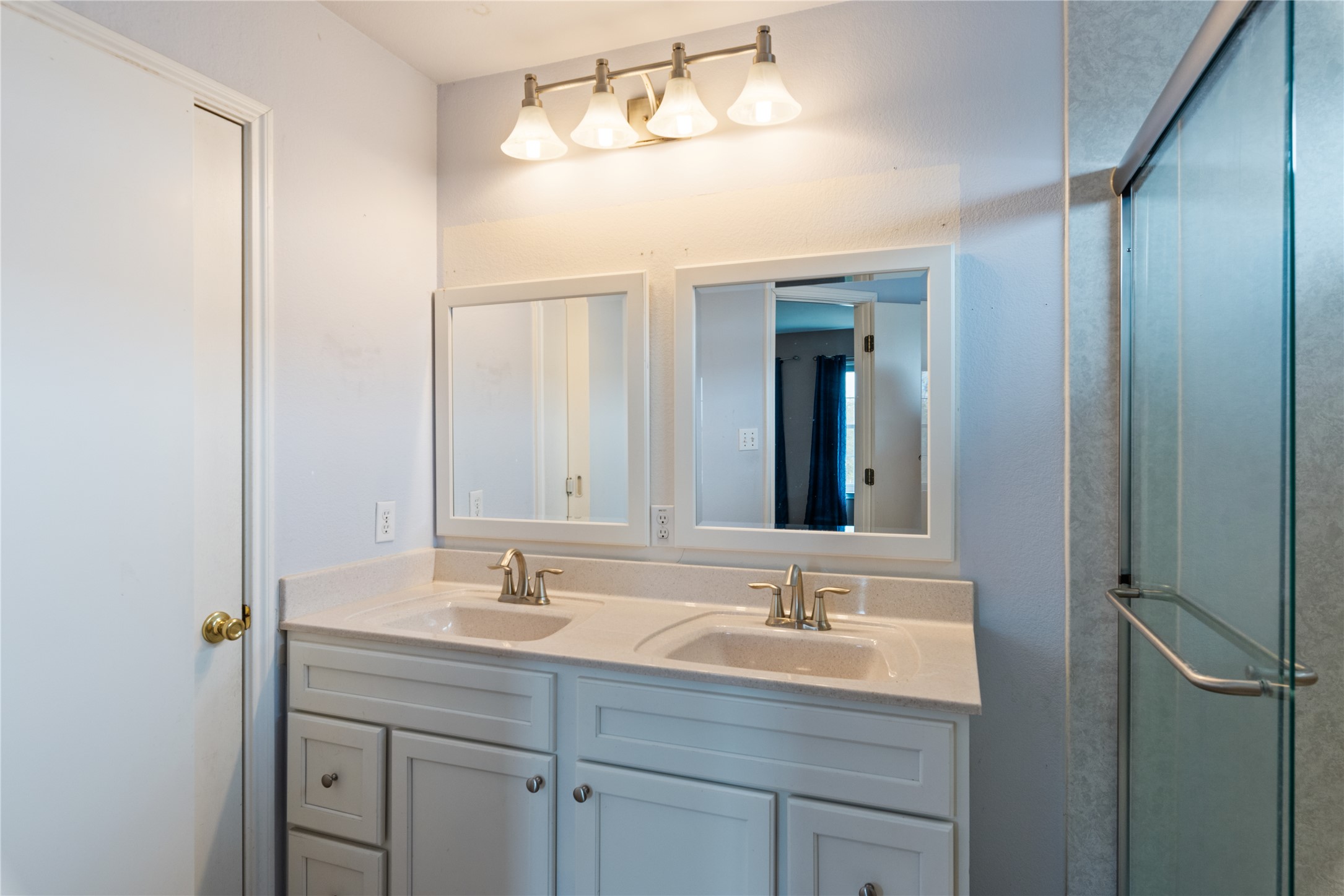 1329 Amberwood Loop Kyle, TX 78640 - Photo 24 of 27 a bathroom with a sink double vanity and a mirror