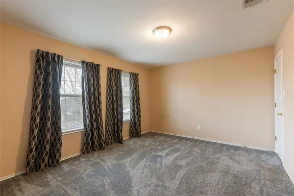 a open kitchen with stainless steel appliances granite countertop a sink dishwasher stove and refrigerator with wooden floor