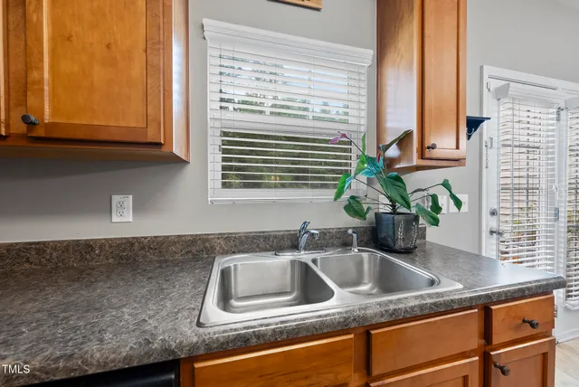 a kitchen sink with a window