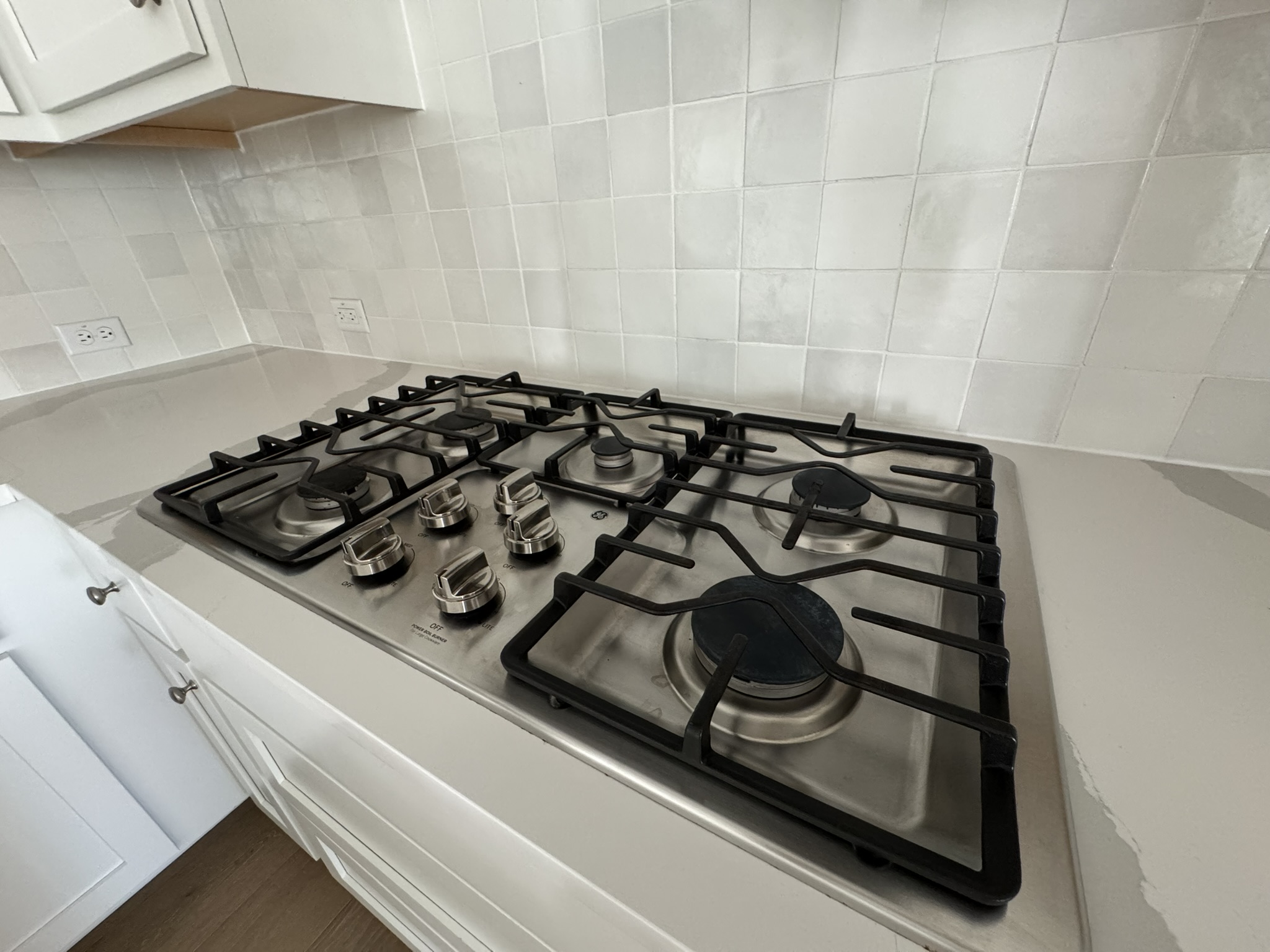 4500 Modena Bend Leander, TX 78641 - Photo 22 of 22 Kitchen view of stainless steel gas cooktop, tasteful backsplash, and white cabinetry