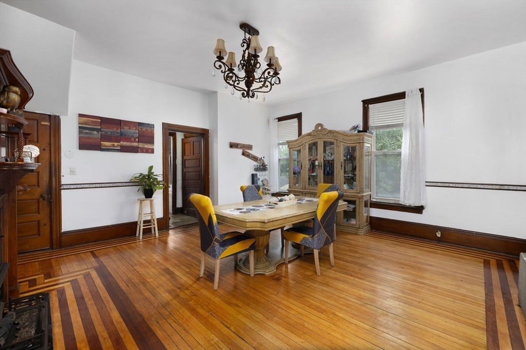 311 Elm Street Woonsocket, RI 02895 - Photo 14 of 29 a view of a dining room with furniture and wooden floor