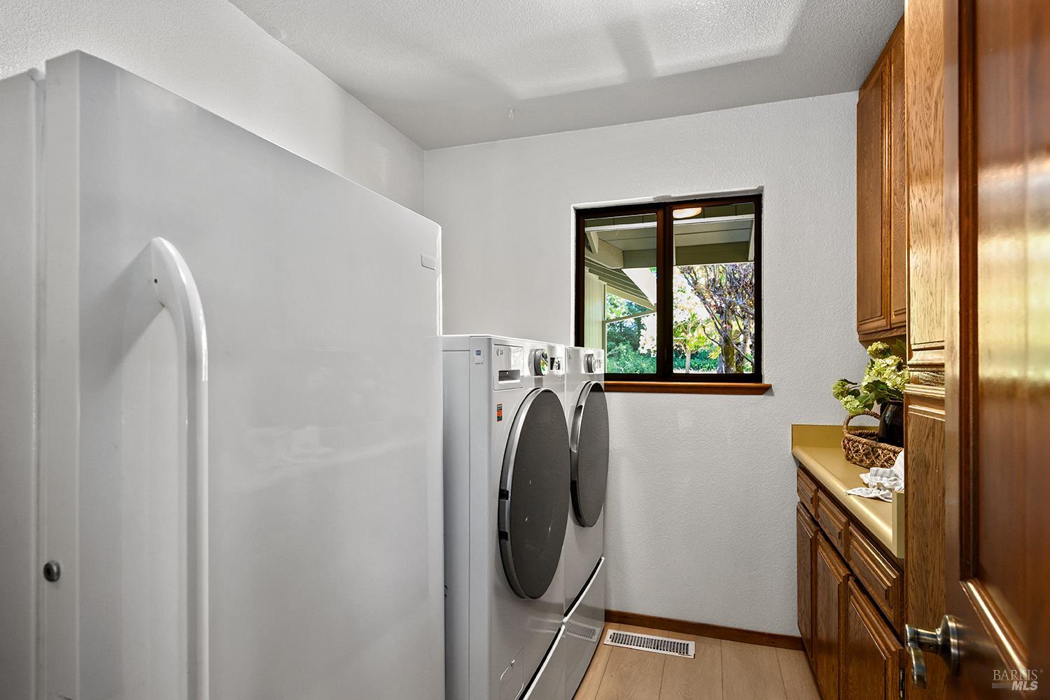 7595 Giusti Road Forestville, CA 95436 - Photo 36 of 41 a utility room with dryer and washer