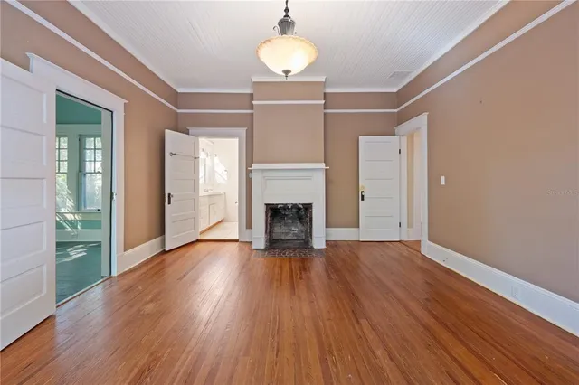 a view of entryway with window and wooden floor
