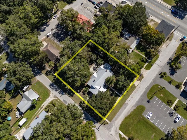 an aerial view of a house with swimming pool
