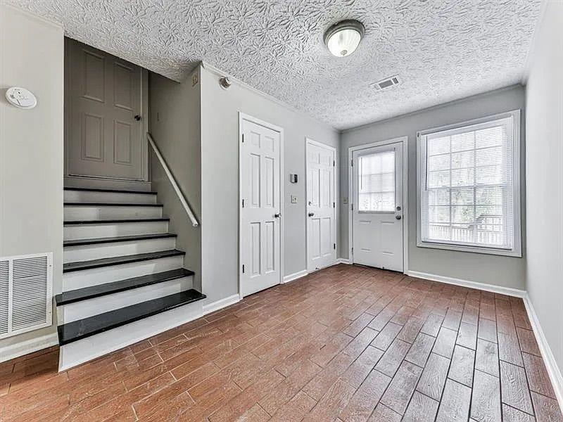 1400 Boxwood Trace Northwest Acworth, GA 30102 - Photo 17 of 23 an empty room with wooden floor and windows