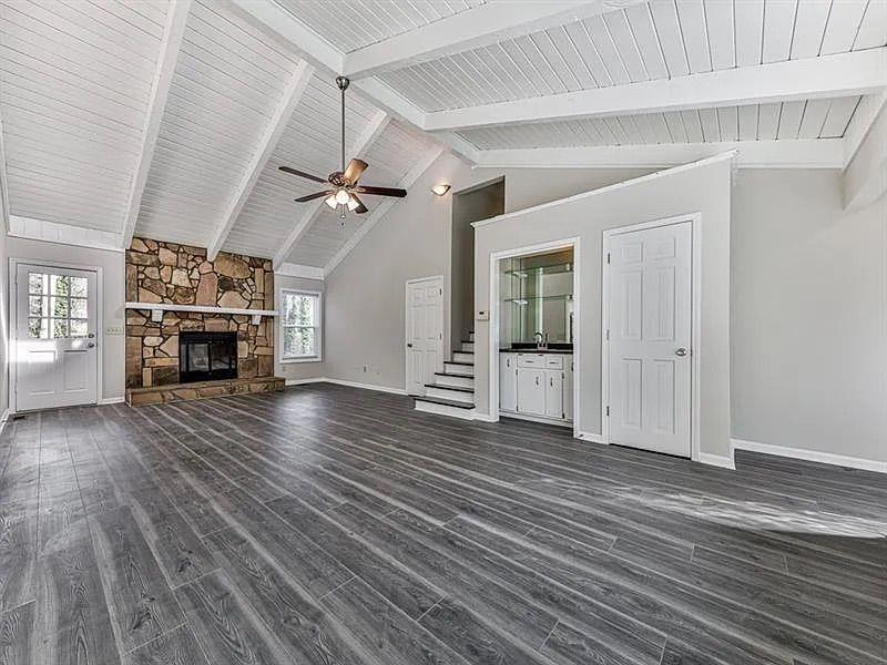 1400 Boxwood Trace Northwest Acworth, GA 30102 - Photo 7 of 23 an empty room with wooden floor fireplace and windows