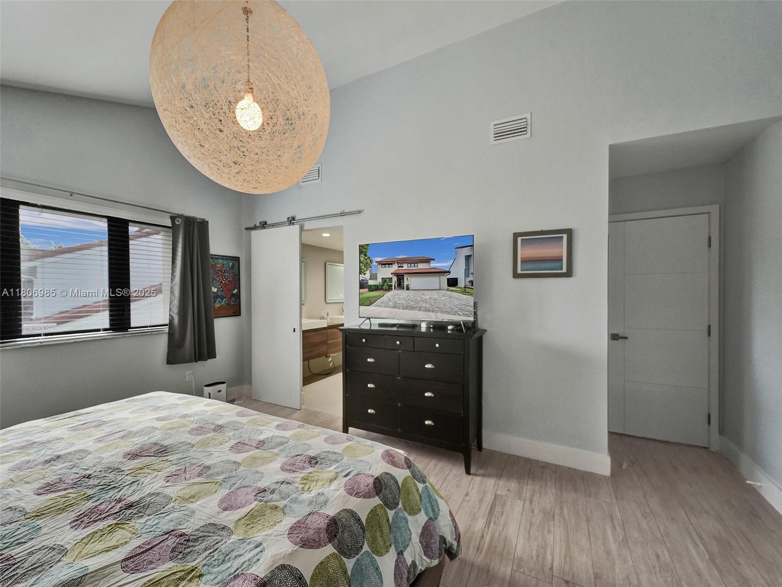 3638 Southwest 57th Avenue Miami, FL 33155 - Photo 12 of 43 a bedroom with a bed and window