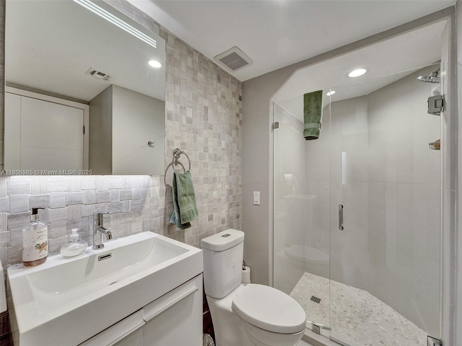 3638 Southwest 57th Avenue Miami, FL 33155 - Photo 19 of 43 a bathroom with a sink toilet and shower