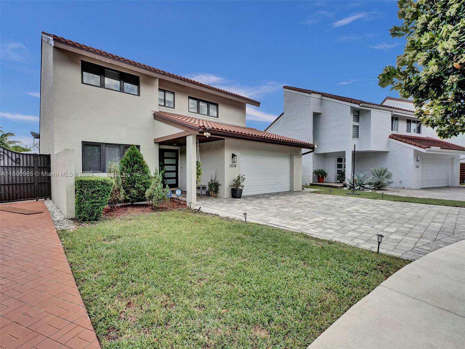 3638 Southwest 57th Avenue Miami, FL 33155 - Photo 2 of 43 a front view of a house with a yard