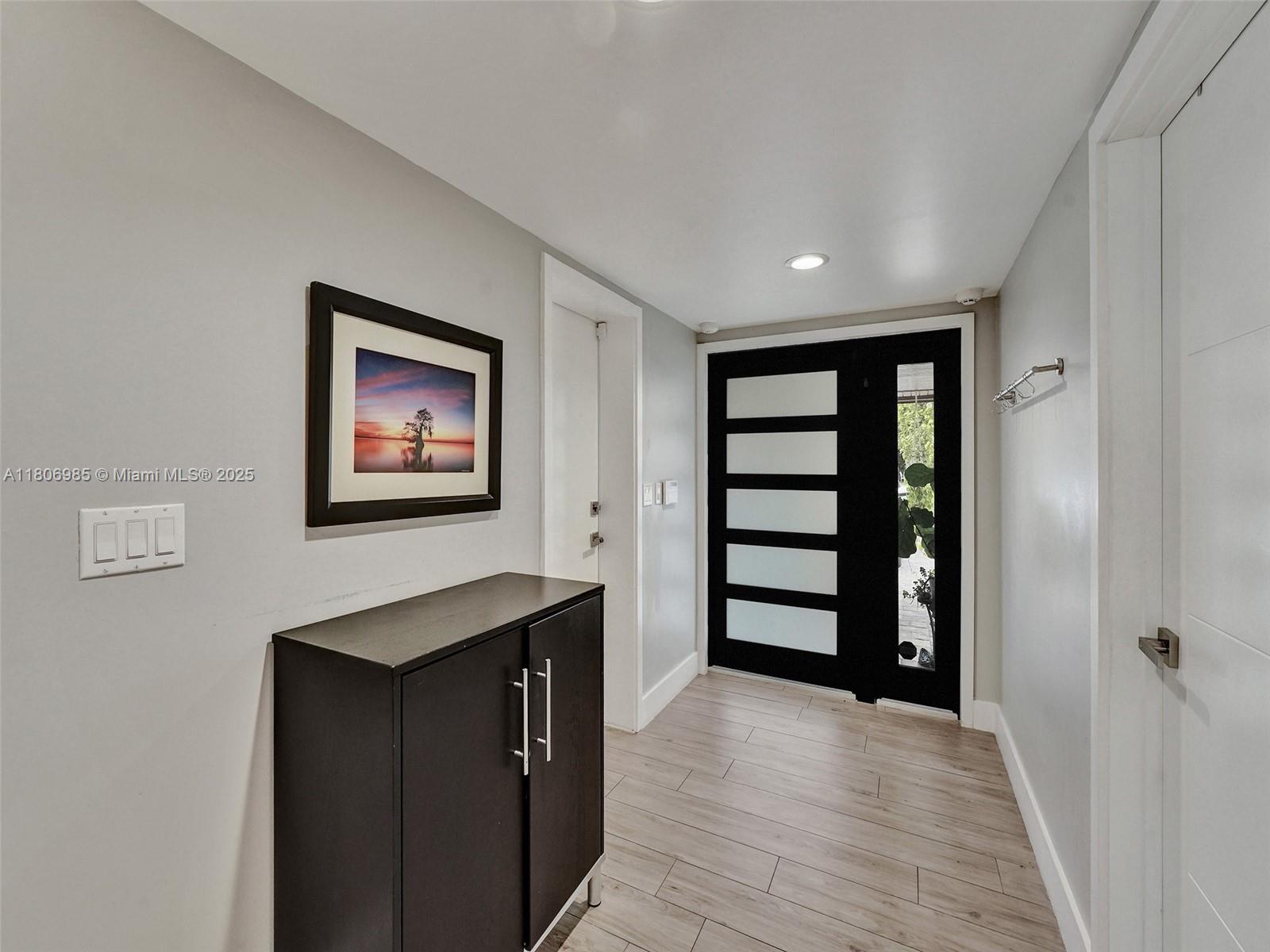 3638 Southwest 57th Avenue Miami, FL 33155 - Photo 3 of 43 wooden floor in an empty room with a window