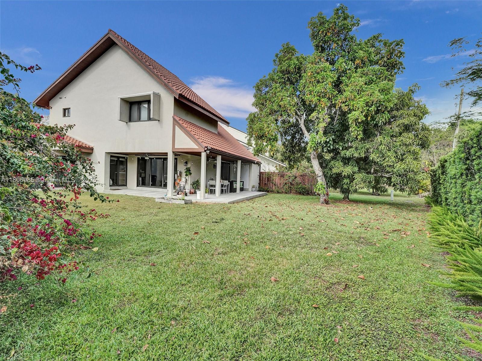 3638 Southwest 57th Avenue Miami, FL 33155 - Photo 35 of 43 a front view of a house with a garden