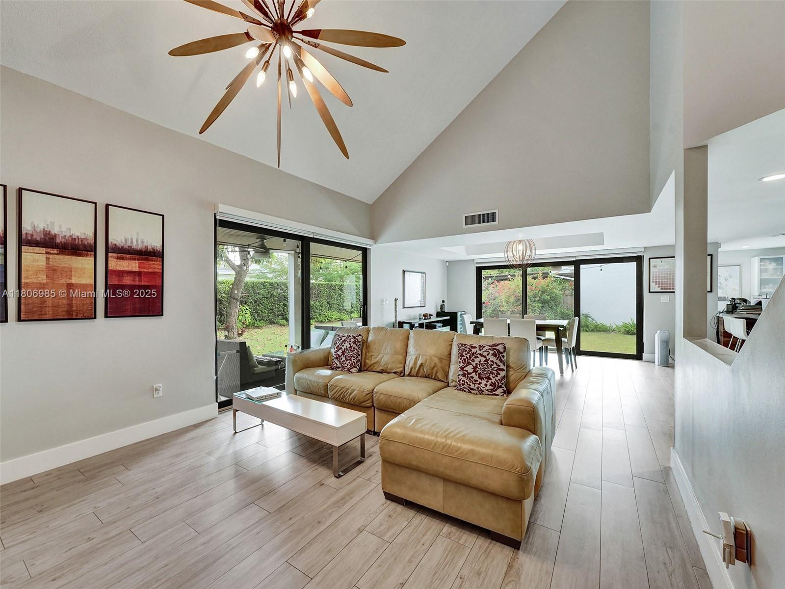 3638 Southwest 57th Avenue Miami, FL 33155 - Photo 4 of 43 a living room with furniture and a large window