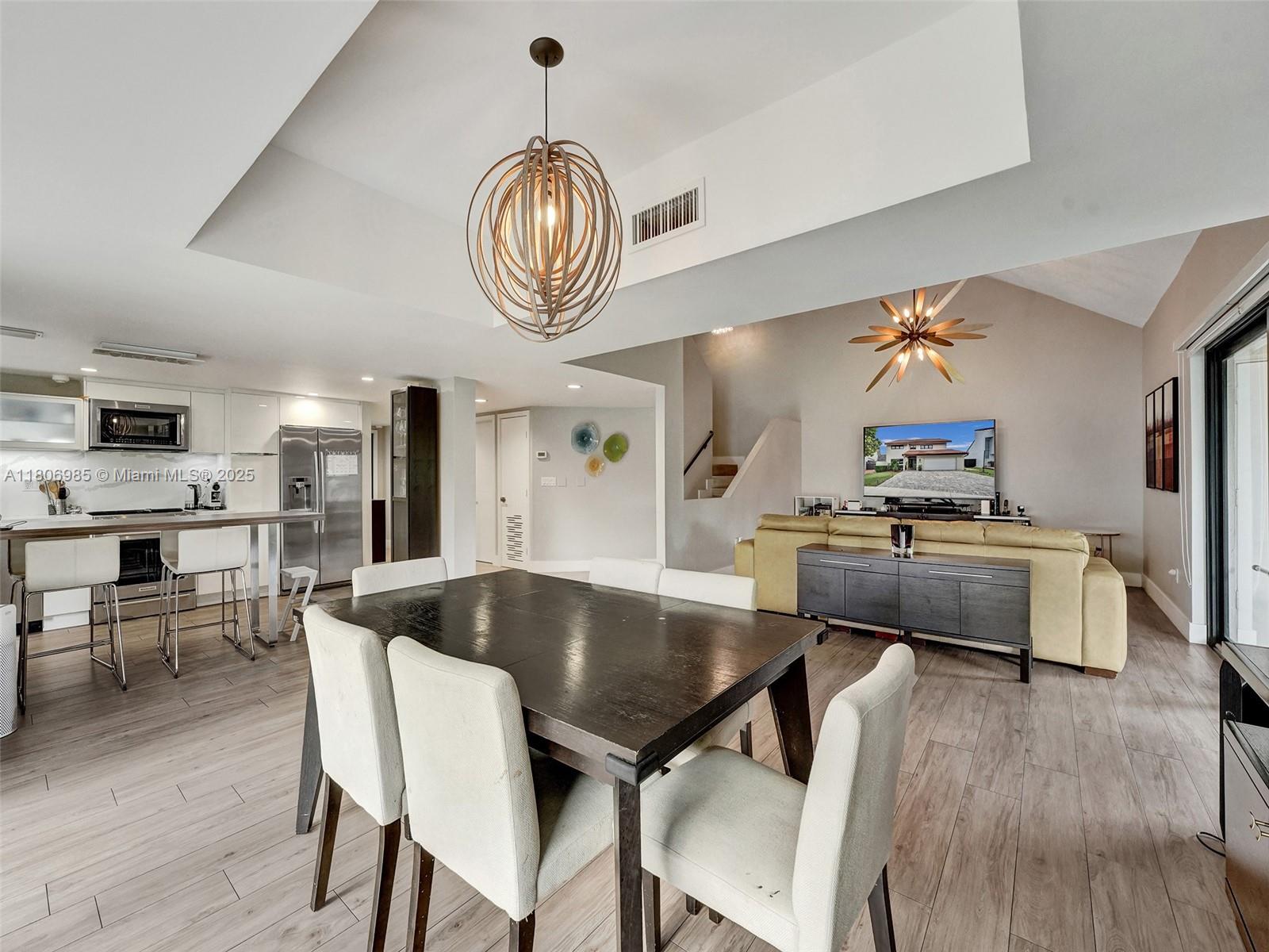 3638 Southwest 57th Avenue Miami, FL 33155 - Photo 7 of 43 a view of kitchen and dining area with wooden floor