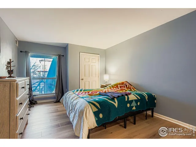 a bedroom with a bed and a view of bedroom