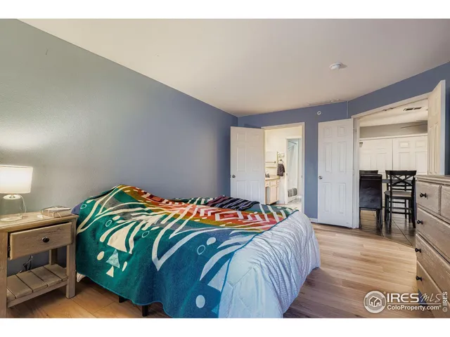 a bedroom with a bed and a television