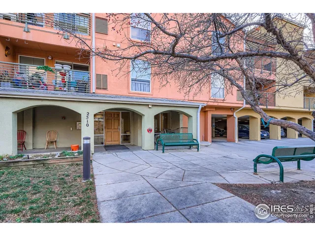 front view of a building with a garden