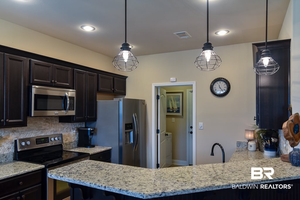 1145 Crown Walk Drive Foley, AL 36535 - Photo 9 of 32 SPACIOUS KITCHEN WITH UPGRADED LIGHTING FIXTURES
