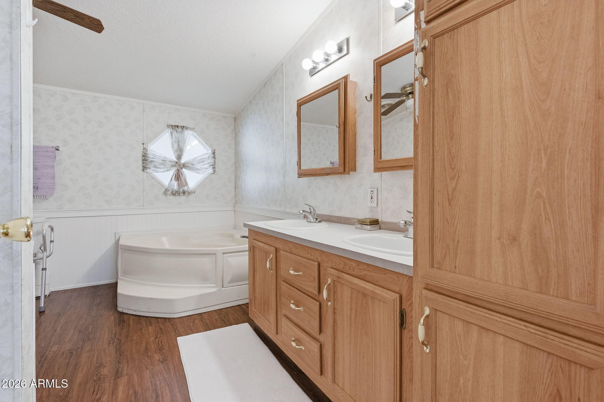 13202 North 19th Way Phoenix, AZ 85022 - Photo 12 of 20 a bathroom with a double vanity sink a toilet and a mirror