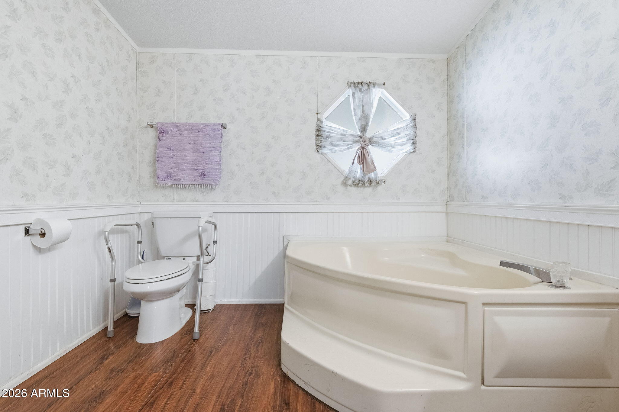 13202 North 19th Way Phoenix, AZ 85022 - Photo 13 of 20 a bathroom with a toilet a sink and wooden floor