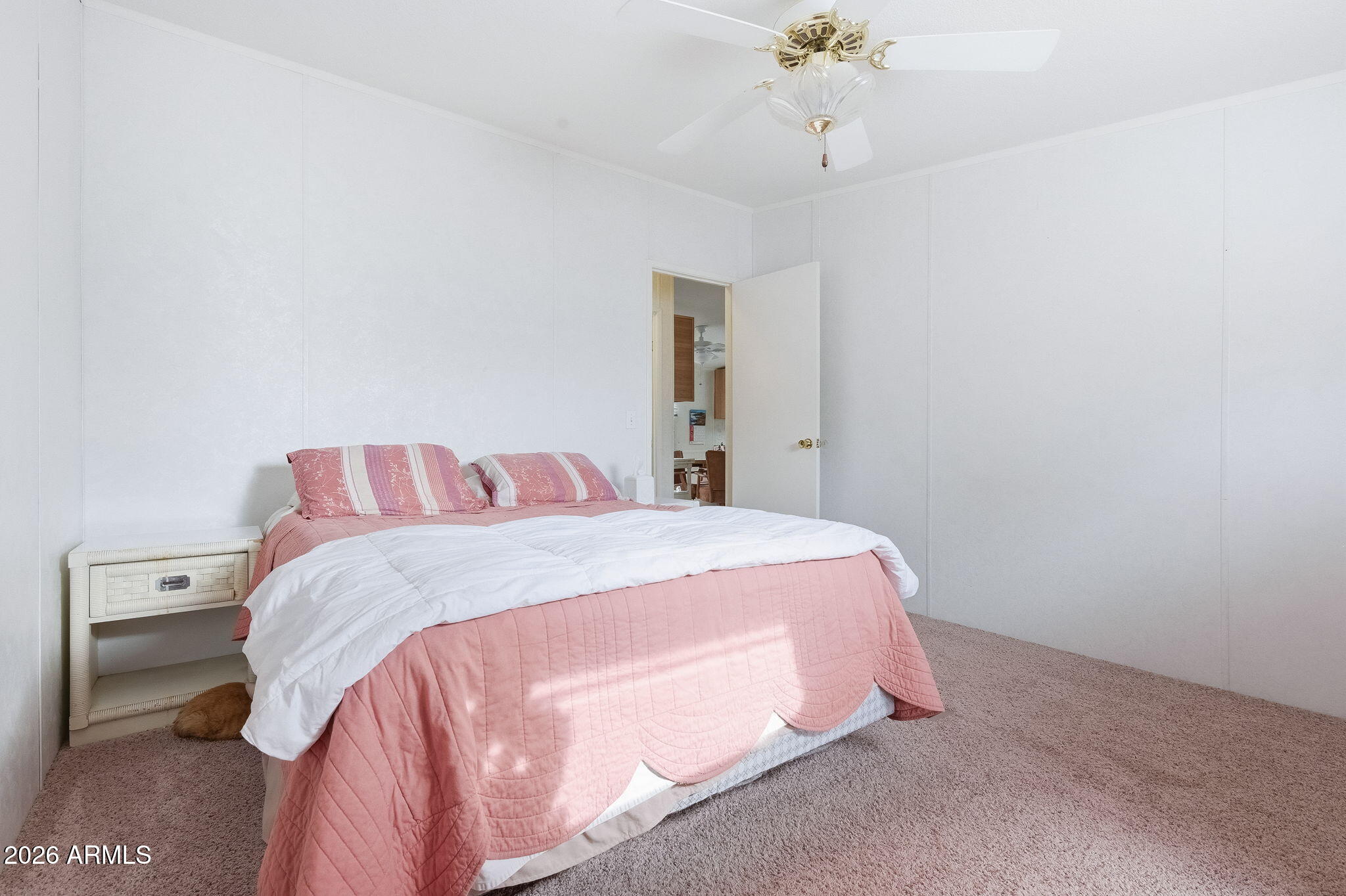 13202 North 19th Way Phoenix, AZ 85022 - Photo 14 of 20 a bedroom with a bed and a chandelier