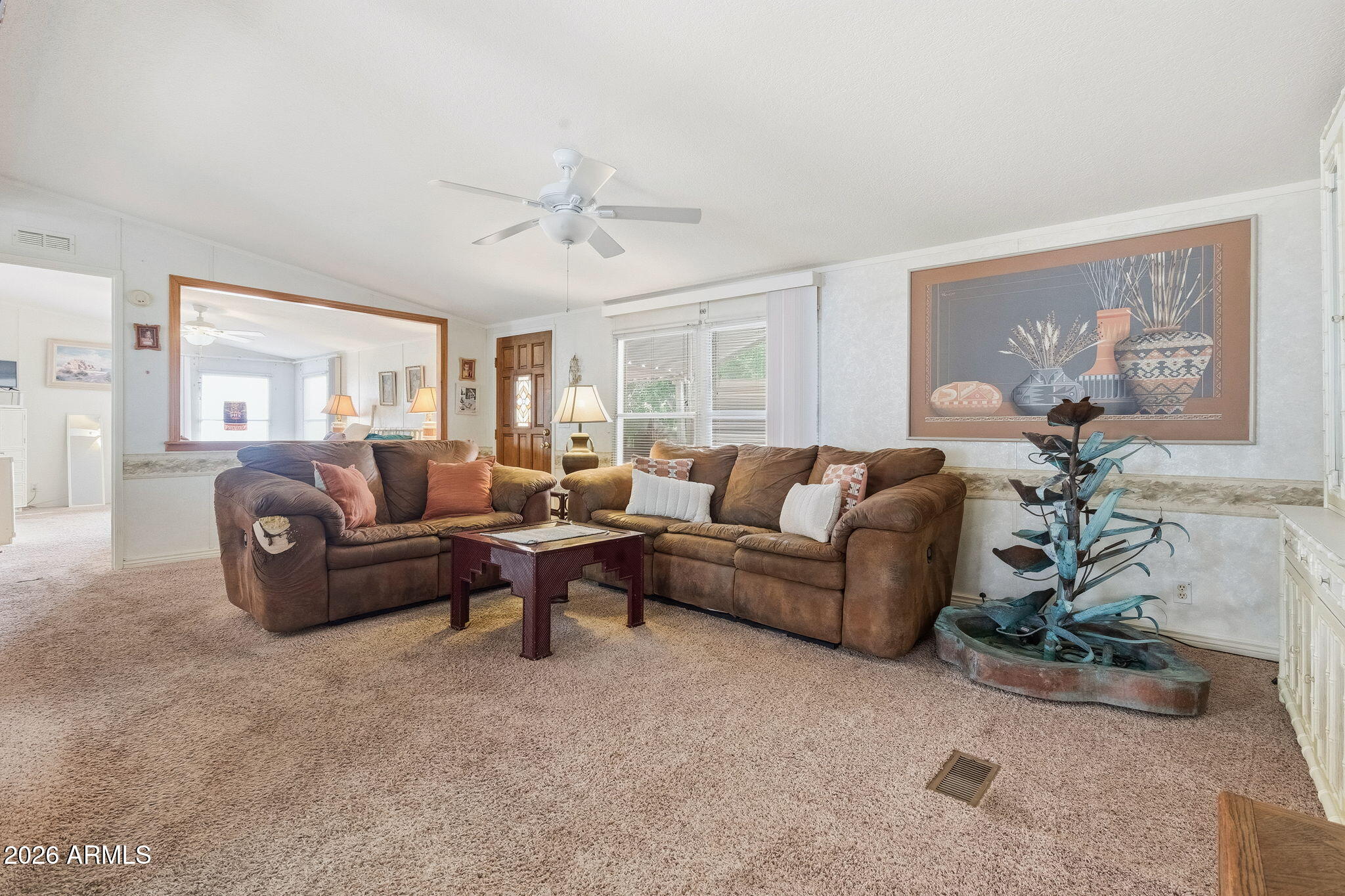 13202 North 19th Way Phoenix, AZ 85022 - Photo 3 of 20 a living room with furniture potted plant and a window