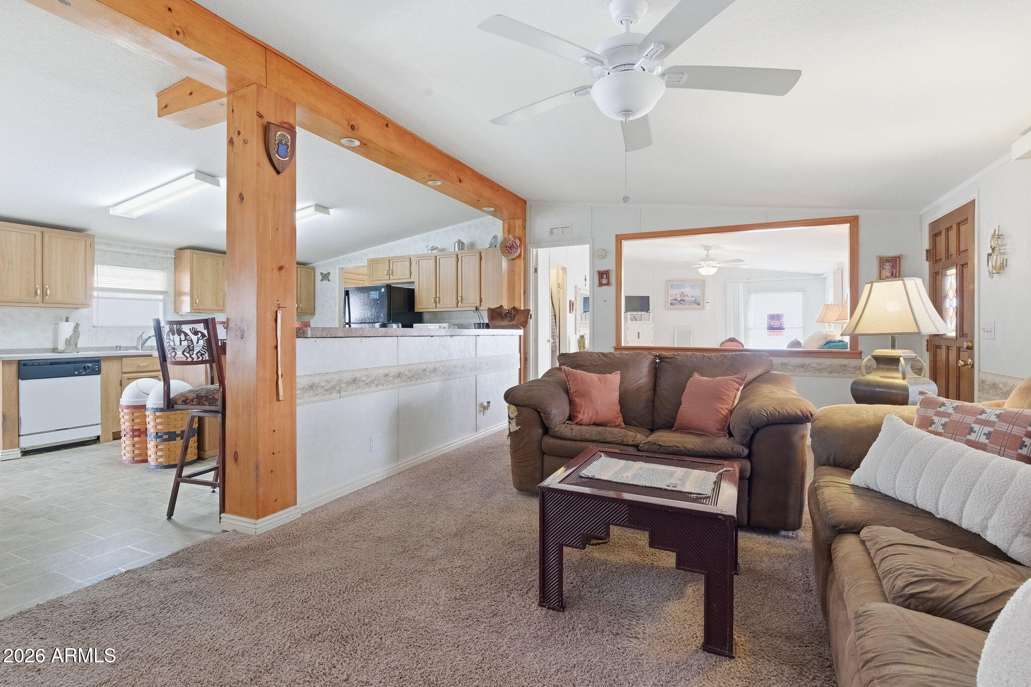 13202 North 19th Way Phoenix, AZ 85022 - Photo 4 of 20 a living room with furniture a large window and a wooden floor