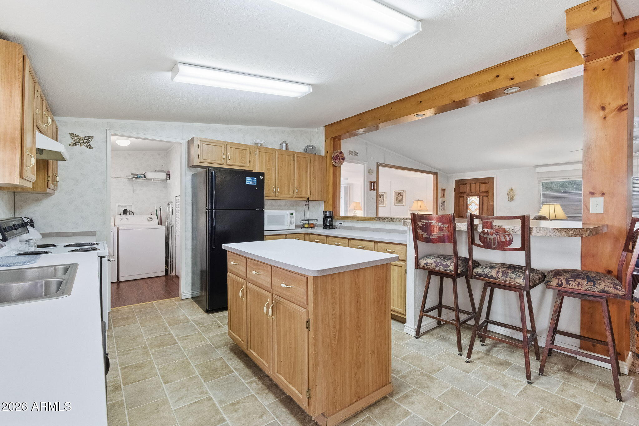 13202 North 19th Way Phoenix, AZ 85022 - Photo 8 of 20 a kitchen with cabinets and chairs